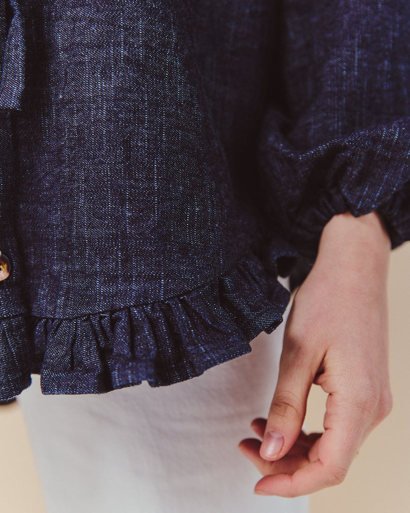 Smart casual oversized denim shirt with frilled hem and buttons made in the UK